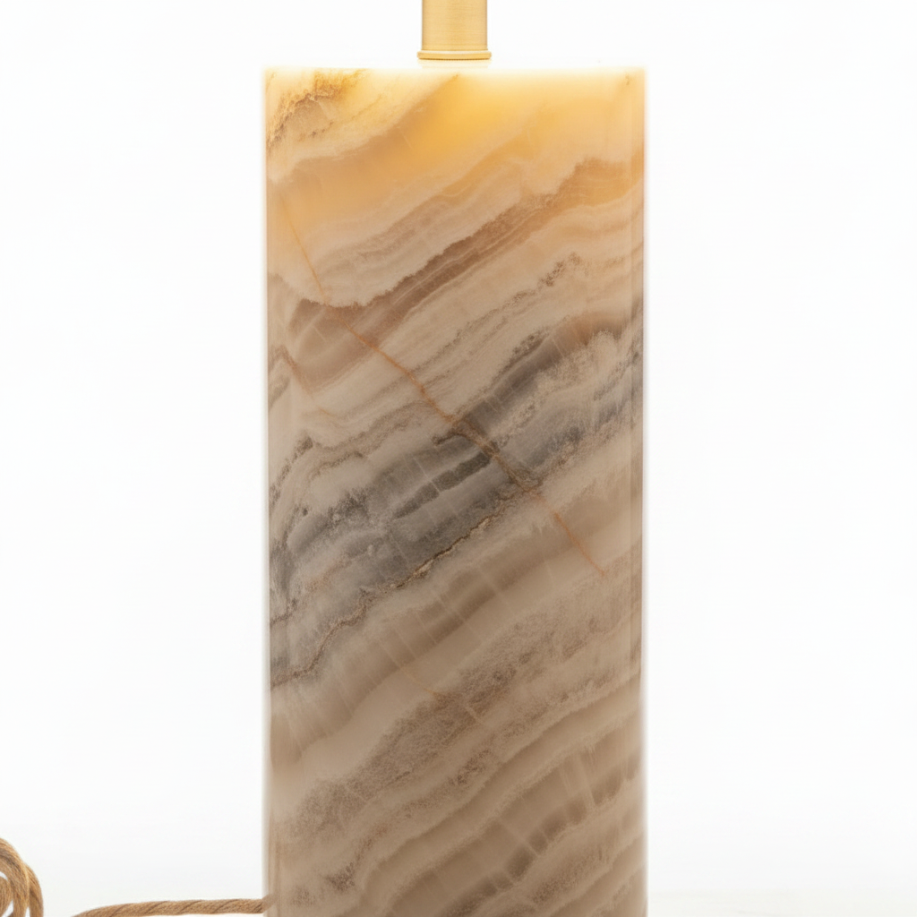 Close up detail of hand-turned alabaster lamp base showing natural stone veining