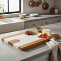 Large marble and acacia wood serving board on white background